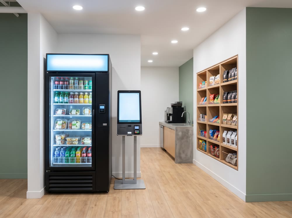 Concept render: full micro market with kiosk, cooler, and snack wall in an office